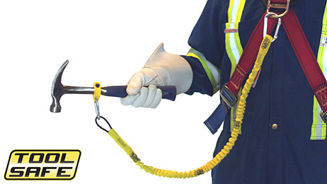 Man holding hammer with ToolSafe® Clamp and Harness Lanyard.